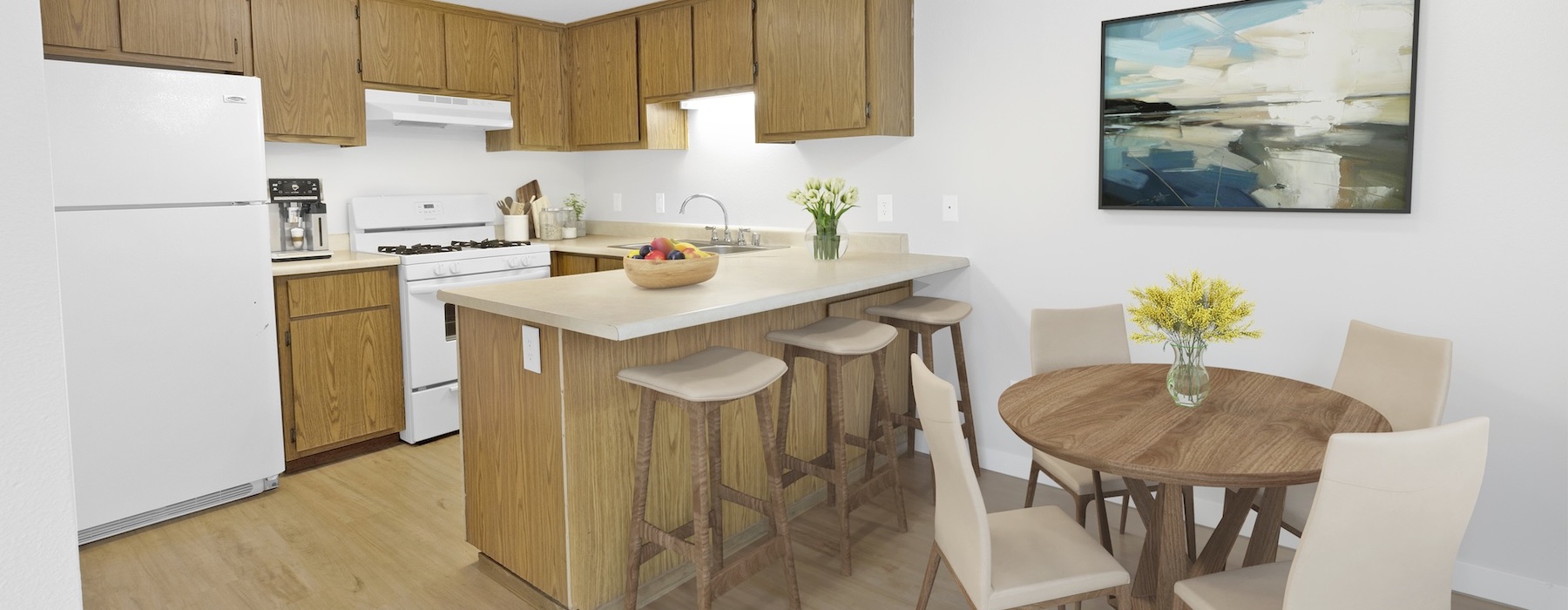 a kitchen with a table and chairs