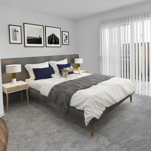 a bedroom with a bed and a lamp
